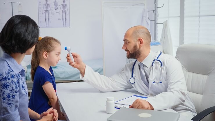 doctor checking evolution fever while nurse taking notes healthcare physician specialist medicine providing health care services radiographic treatment examination hospital cabinet_482257 4777